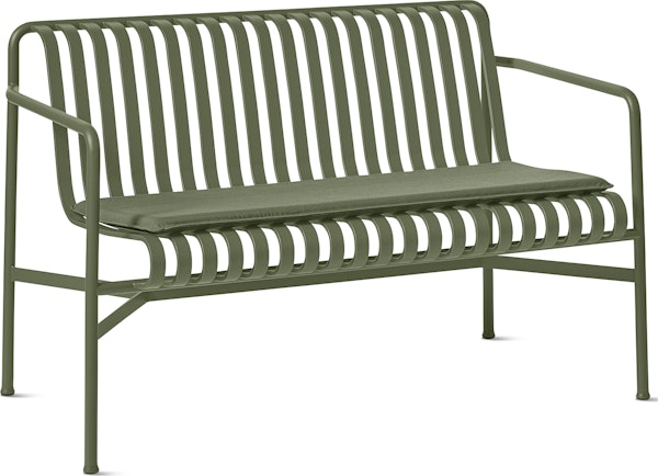 A three quarter view of a Palissade Dining Bench Seat Pad in olive green.